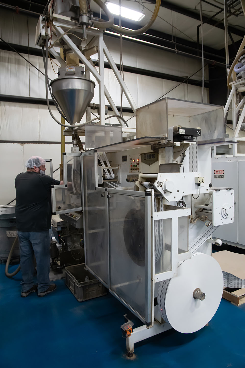 man working on factory machine