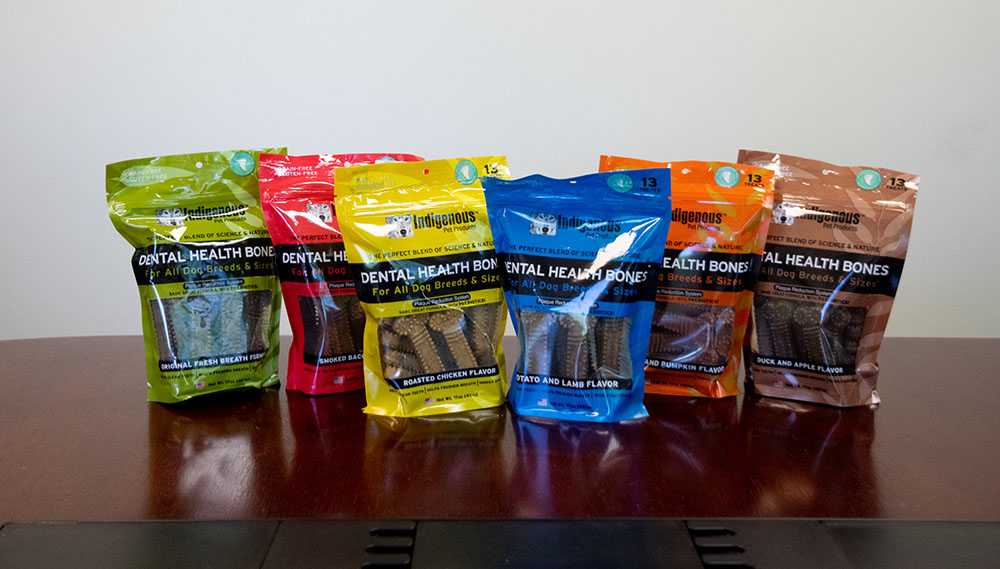 table with variety of dog treats lined up for display